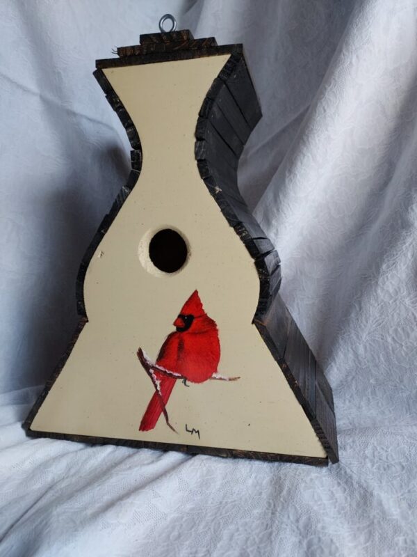 Birdhouse with a red Northern cardinal painted on the front with grey background